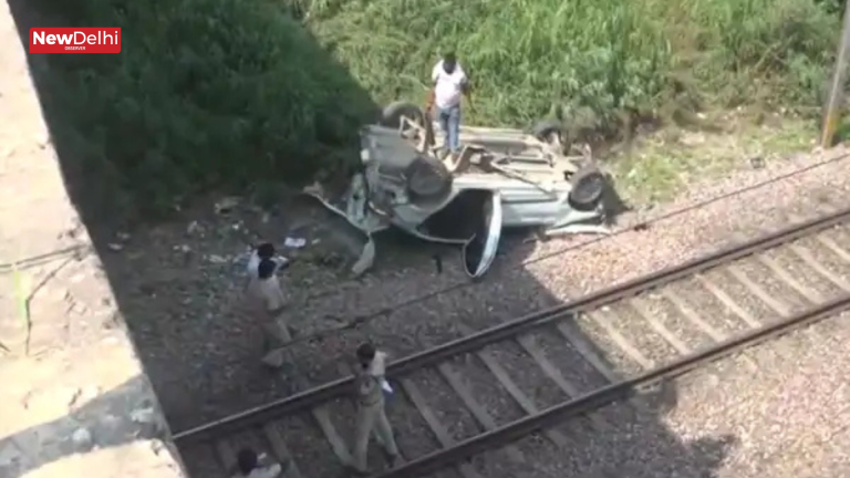 Car Falls Onto Railway Tracks From Flyover